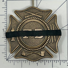 New Product Black silicone mourning band 0.2 inches wide fits badges 1.2 to 2.25 inches offered by badgeart. Band shown on a Maltese firefighters badge against size graph.