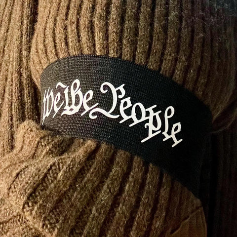 We The People Patriotic Arm Band Brassard Black 2 inch on brown sweater