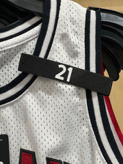 Badgeart Basketball Custom Printed Mourning Band for Jersey shown on a white youth jersey
