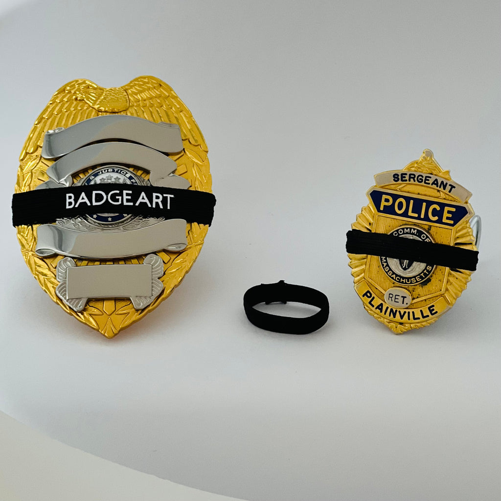 Badgeart Perfect Fit Mourning Bands 1/4 inch for 30-41 mm Wide Badges Custom Cut Welded Flat Back shown beside a Badgeart 3/8 band on a full size badge