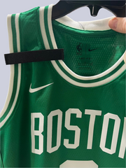 Badgeart mourning band for basketball jersey. Attaches with hook & loop. shown on a Boston Celtics basketball jersey.