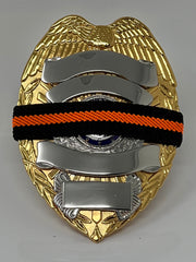 he Stop Gun Violence Wear Orange Awareness / Thin Orange Line Mourning Bands with a thin orange line mourning band 1/2". Band reverses to an all-black mourning band. Public safety officers are wearing thin orange line badge shrouds to raise awareness of gun violence in the community and among police officers, firefighters, Emergency Medical Services and others. Join us in the champagne to Stop Gun Violence. Badges not included.