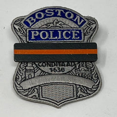 The Stop Gun Violence Wear Orange Awareness / Thin Orange Line Mourning Bars for Cloth Badges and insignia.  Black vinyl with a thin orange line mourning bar with a pair of 1/2" pins with military clasps.  Public safety officers are wearing thin orange line badge shrouds to raise awareness of gun violence in the community and among police officers, firefighters, Emergency Medical Services and others.  J