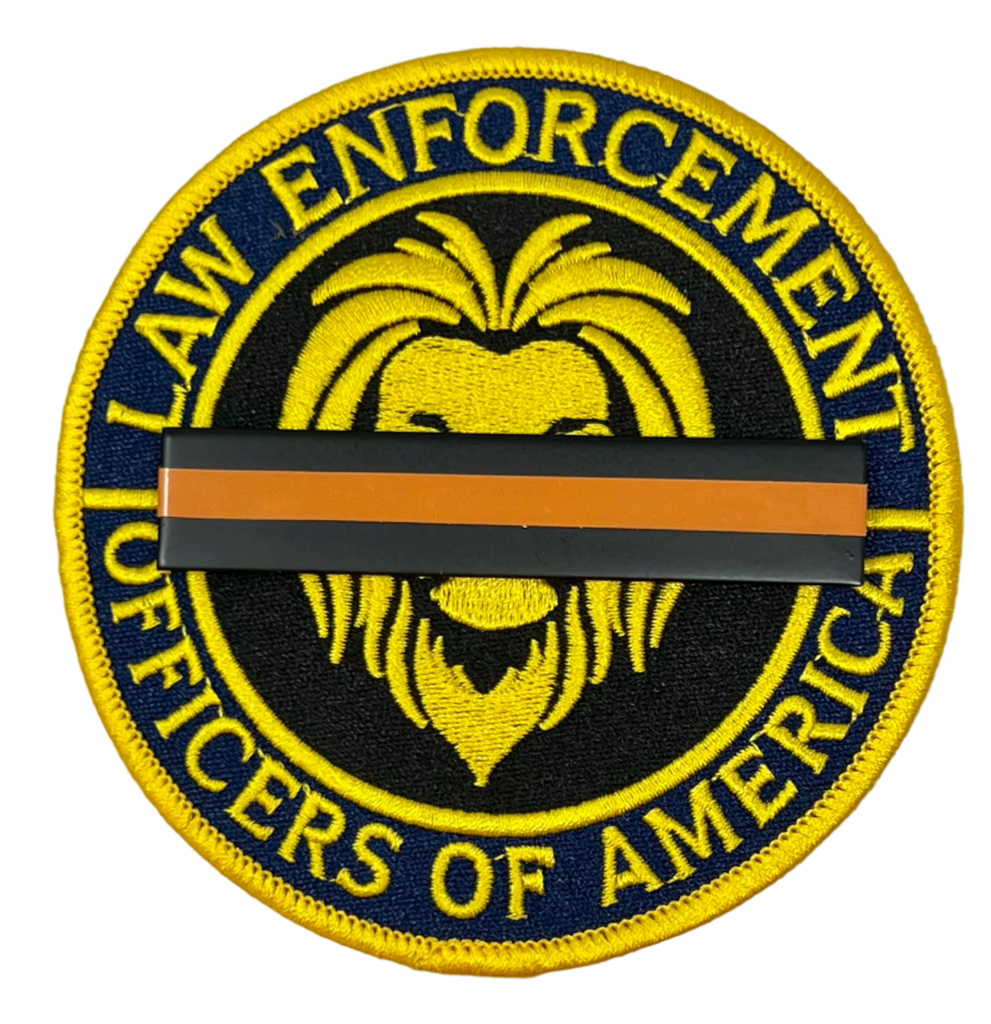 top Gun Violence Wear Orange Awareness / Mourning Bar for covering law enforcement, firefighter, EMS, agents, officers and other uniform patches and badges. 3" x 5/8" Wear Orange for Stop Gun Violence Awareness J288-SGV Black/Orange/Black Metal Mourning Bar with Orange Band that has 2 F9 nails (5/16" long) with clutch back attachments. Best worn over a badge patch that is on a shirt.