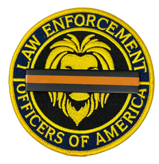 top Gun Violence Wear Orange Awareness / Mourning Bar for covering law enforcement, firefighter, EMS, agents, officers and other uniform patches and badges. 3" x 5/8" Wear Orange for Stop Gun Violence Awareness J288-SGV Black/Orange/Black Metal Mourning Bar with Orange Band that has 2 F9 nails (5/16" long) with clutch back attachments. Best worn over a badge patch that is on a shirt.