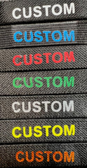 Badgeart custom printed mourning bands offered in multiple colors. Image shows 7 colors on bands