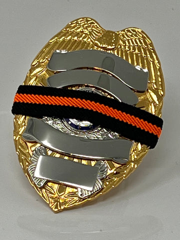 he Stop Gun Violence Wear Orange Awareness / Thin Orange Line Mourning Bands with a thin orange line mourning band 1/2". Band reverses to an all-black mourning band. Public safety officers are wearing thin orange line badge shrouds to raise awareness of gun violence in the community and among police officers, firefighters, Emergency Medical Services and others. Join us in the champagne to Stop Gun Violence. Badges not included.