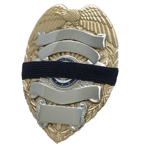 Black 1/2 inch mourning band for metal polce, fire, ems and other badges by Badgeart on gold and silver badge offered by mourningbands.org