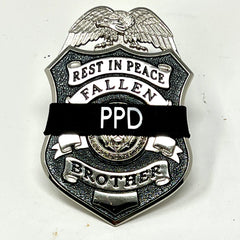 Badgerart custompersonalized  printed mourning band shown on a law enforcement officer of america fallen brother badge.