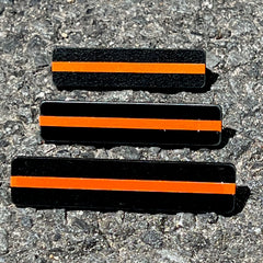 The Stop Gun Violence Wear Orange Awareness / Thin Orange Line Mourning Bars for Cloth Badges and insignia.  Black vinyl with a thin orange line mourning bar with a pair of 1/2" pins with military clasps.  Public safety officers are wearing thin orange line badge shrouds to raise awareness of gun violence in the community and among police officers, firefighters, Emergency Medical Services and others.  J
