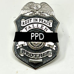 Badgerart custom printed mourning band shown on a law enforcement officer of america fallen brother badge.
